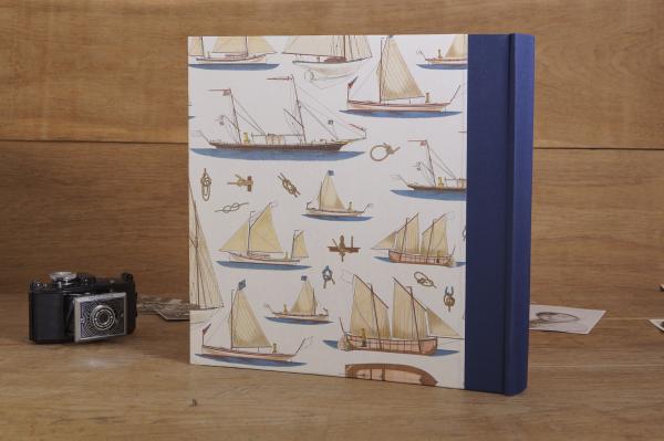 Nautical album with navy blue linen spine and sailing boats